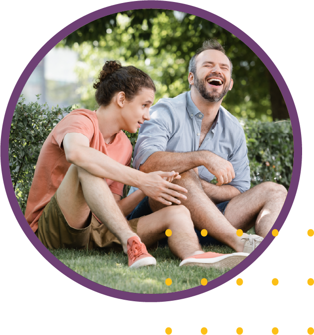 A father and son talking together in a park